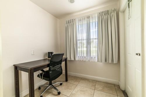 a room with a desk and a chair at Everglades City Motel - Everglades Adventures Inn in Everglades City