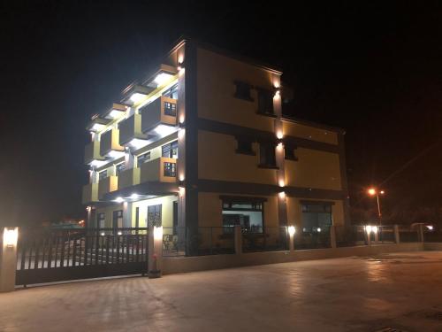 a large building with lights on it at night at 太魯閣惠宇民宿 in Xincheng