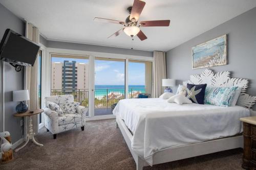a bedroom with a white bed and a large window at Sterling Shores V in Destin