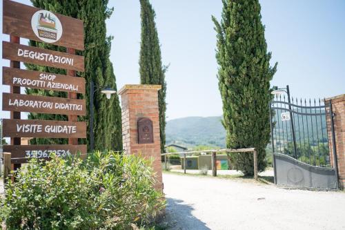 a sign for a skate park with trees and a gate at Fattoria Didattica La Collina Incantata in Narni