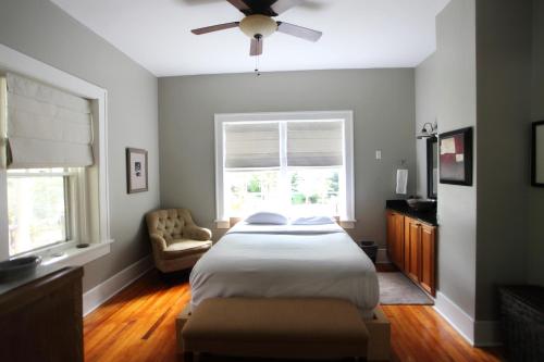 a bedroom with a large bed and a window at The Pines Cottages in Asheville