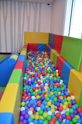 a room with a bunch of balls in it at The Lodge Suites in Manama