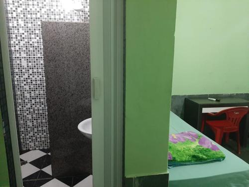 Ett badrum på Pousada Alojamento Fragoso