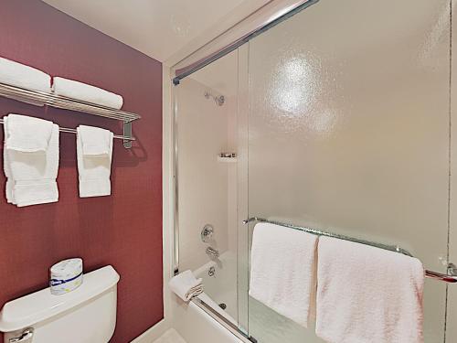 a bathroom with a shower and a toilet and towels at Timberline Condominiums 3 Bedroom Standard Unit D3A in Snowmass Village