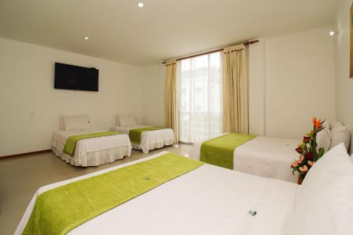 Una cama o camas en una habitación de Hotel Imbanaco