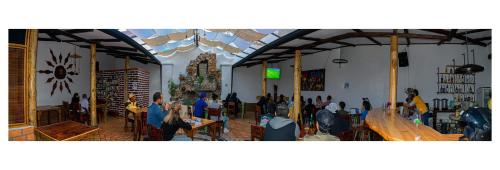 a group of people sitting in a room at Hostal Yakumama in Cuenca