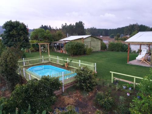 an aerial view of a backyard with a swimming pool at Cabañas Don Tito in Buchupureo