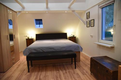 a bedroom with a large bed and a window at Gästehaus pack of patches in Jena