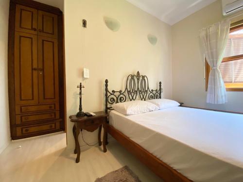 Ένα ή περισσότερα κρεβάτια σε δωμάτιο στο Casa alto padrão em condomínio fechado - São Roque