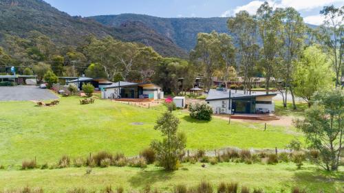 a large field with a bunch of trees and houses at Grampians Villas in Halls Gap