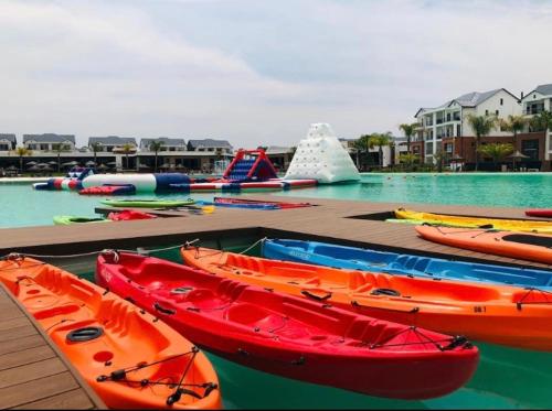 a group of kayaks on a dock in a water park at Serenity in Pretoria
