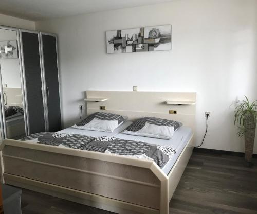 a bedroom with a large bed in a room at Ferienwohnung Nüdling in Hilders