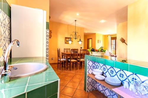 a bathroom with a tub and a sink at Apartamentos Sierra Tejeda in Alcaucín