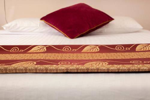 a bed with a pillow on top of it at Manjimup Motor Inn in Manjimup