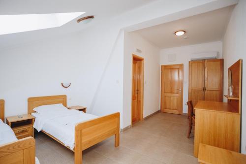 Кровать или кровати в номере Eco Winery Lipovac Apartments