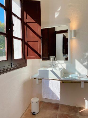 a bathroom with a sink and a mirror at El Molino Estepona in Estepona