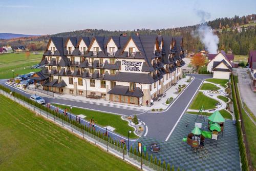 a rendering of a large building on a street at Borowy Dwór- Biznes, Spa & Fun in Szaflary