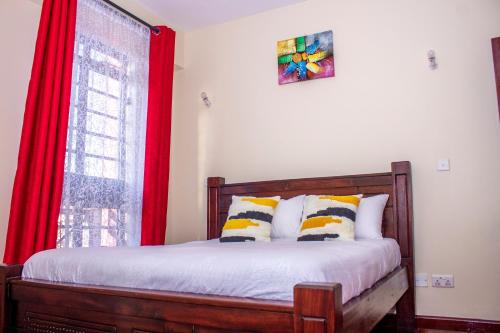 Tempat tidur dalam kamar di Kasty M Apartments- W Place