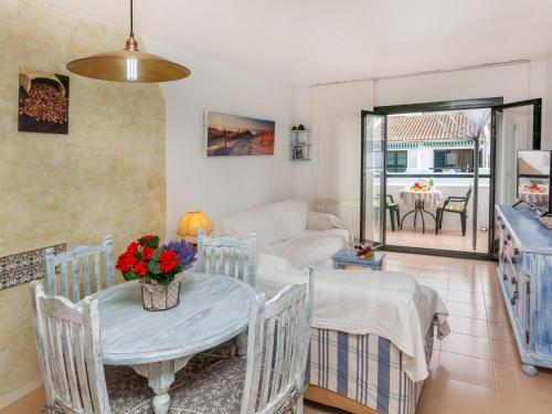 a living room with a table and chairs at Apartment Coto Gamo Holiday Escape by Interhome in Pals