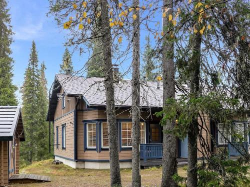 a house in the woods with trees at Holiday Home Tähti b by Interhome in Syöte