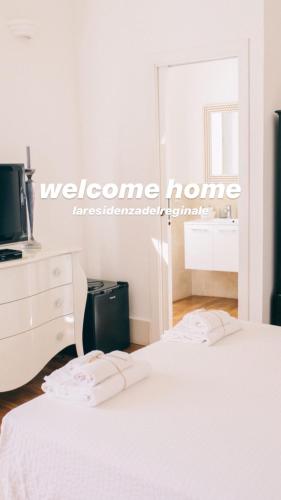 a bedroom with two beds and a dresser and a mirror at La Residenza del Reginale in Siracusa