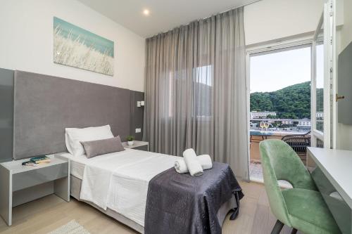 Postel nebo postele na pokoji v ubytování Art Hotel Dubrovnik