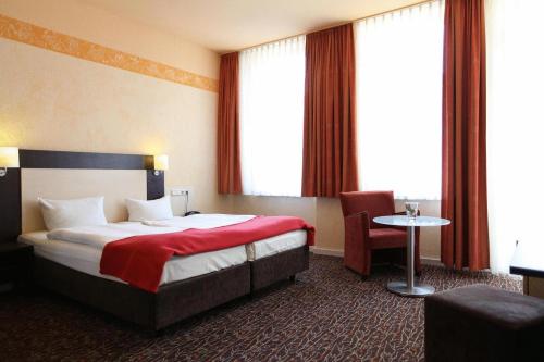 En eller flere senger på et rom på Adesso Hotel Kassel -pay at property on arrival- Ihr Automatenhotel in Kassel