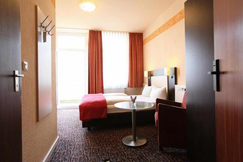 Postel nebo postele na pokoji v ubytování Adesso Hotel Kassel -pay at property on arrival- Ihr Automatenhotel in Kassel