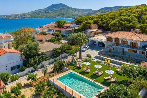 an aerial view of a villa with a swimming pool at Villa Artemida Vravrona in Vravrona