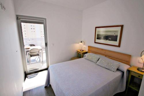 A bed or beds in a room at Agueda - sea view apartment in Calpe