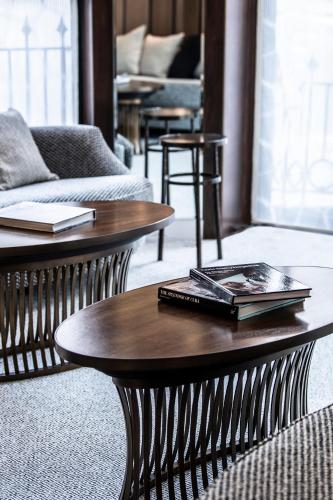 a coffee table with a book on it in a living room at One Aldwych in London