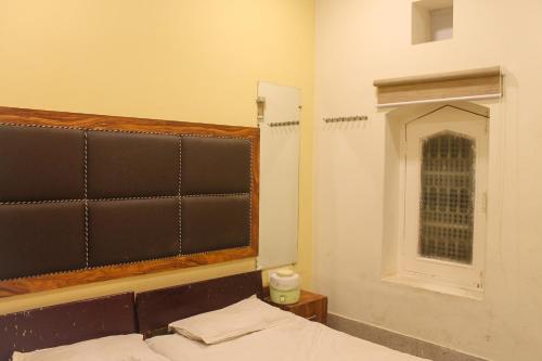 Hotel Anand Palaceにあるベッド