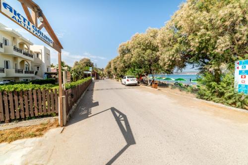 a street with a car parked on the side of the road at Akti Galinis in Kalyves