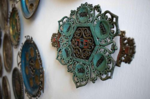 a cuckoo clock hanging on a wall at Tzefania Hotel in Jerusalem