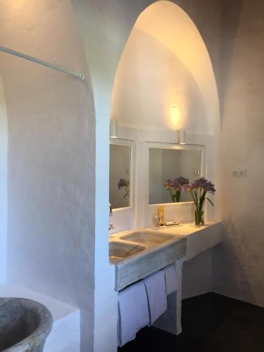 a bathroom with a sink and a mirror at El Molino Estepona in Estepona