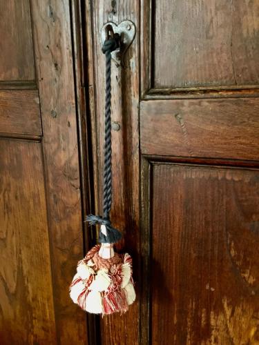 a doorhandle with a toy on a wooden door at El Molino Estepona in Estepona
