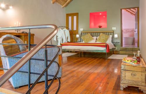 Mimosa Lodge tesisinde bir odada yatak veya yataklar