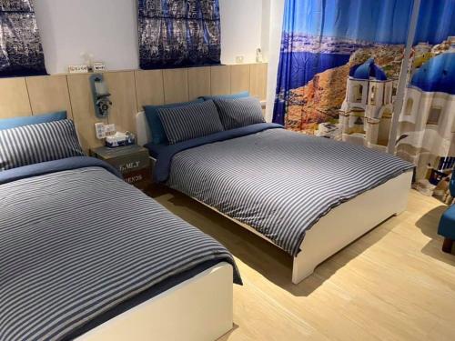 una camera con 2 letti di Blue House a Jincheng