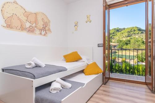 Postel nebo postele na pokoji v ubytování Sa Tanca de sa Nina