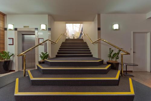 a set of stairs in a building at Madison Capital Executive Apartments in Canberra