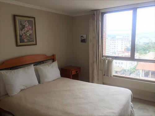 Tempat tidur dalam kamar di 4 Norte 221 Vista al Mar y Casino