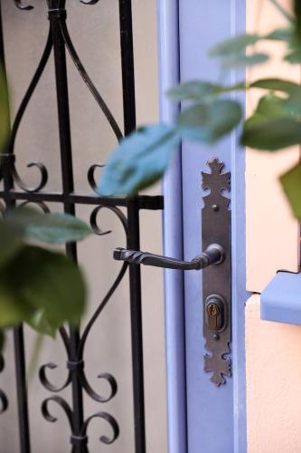 a metal fence with a lock on a gate at Hotel De L'Horloge in Paris