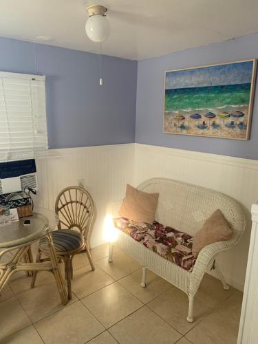 a living room with a couch and a table at Tropical Cottages in Marathon