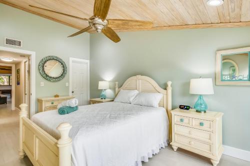 a bedroom with a bed and a ceiling fan at Executive Bay Club Condo M-1 in Islamorada