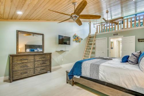 a bedroom with a bed and a ceiling fan at Executive Bay Club Condo M-1 in Islamorada