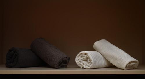 three rolls of toilet paper sitting on a shelf at Castle in Blue Apartments-Sea View in Sines