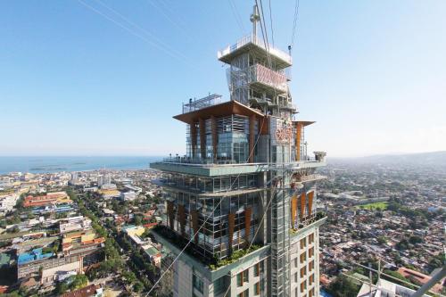 a tall building being constructed on top of a city at Crown Regency Hotel & Towers in Cebu City