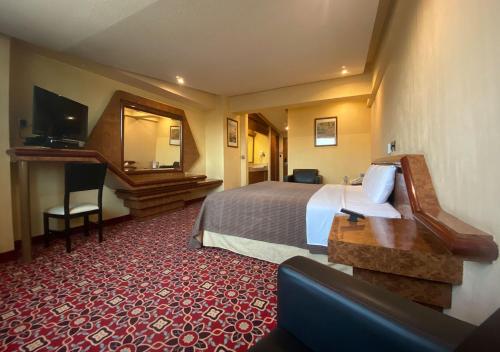 Postel nebo postele na pokoji v ubytování Hotel Escala Central del Norte