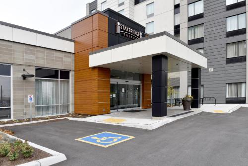 a parking lot in front of a building at Staybridge Suites - Waterloo - St. Jacobs Area in Waterloo