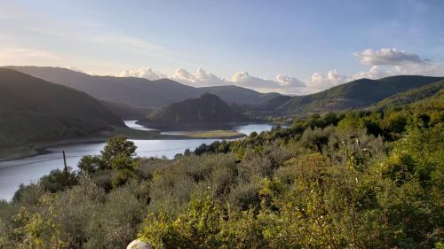 a view of a river in a valley with mountains at Amazing Lake View in Castel di Tora